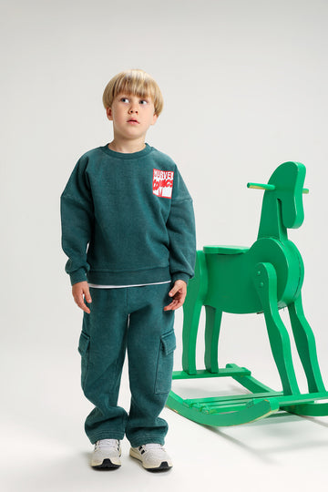 Shop boys’ Marvel Comics Melton tracksuit – dark grey sweatshirt and cargo pants set. Cozy cotton fabric, stylish and warm for winter days.
