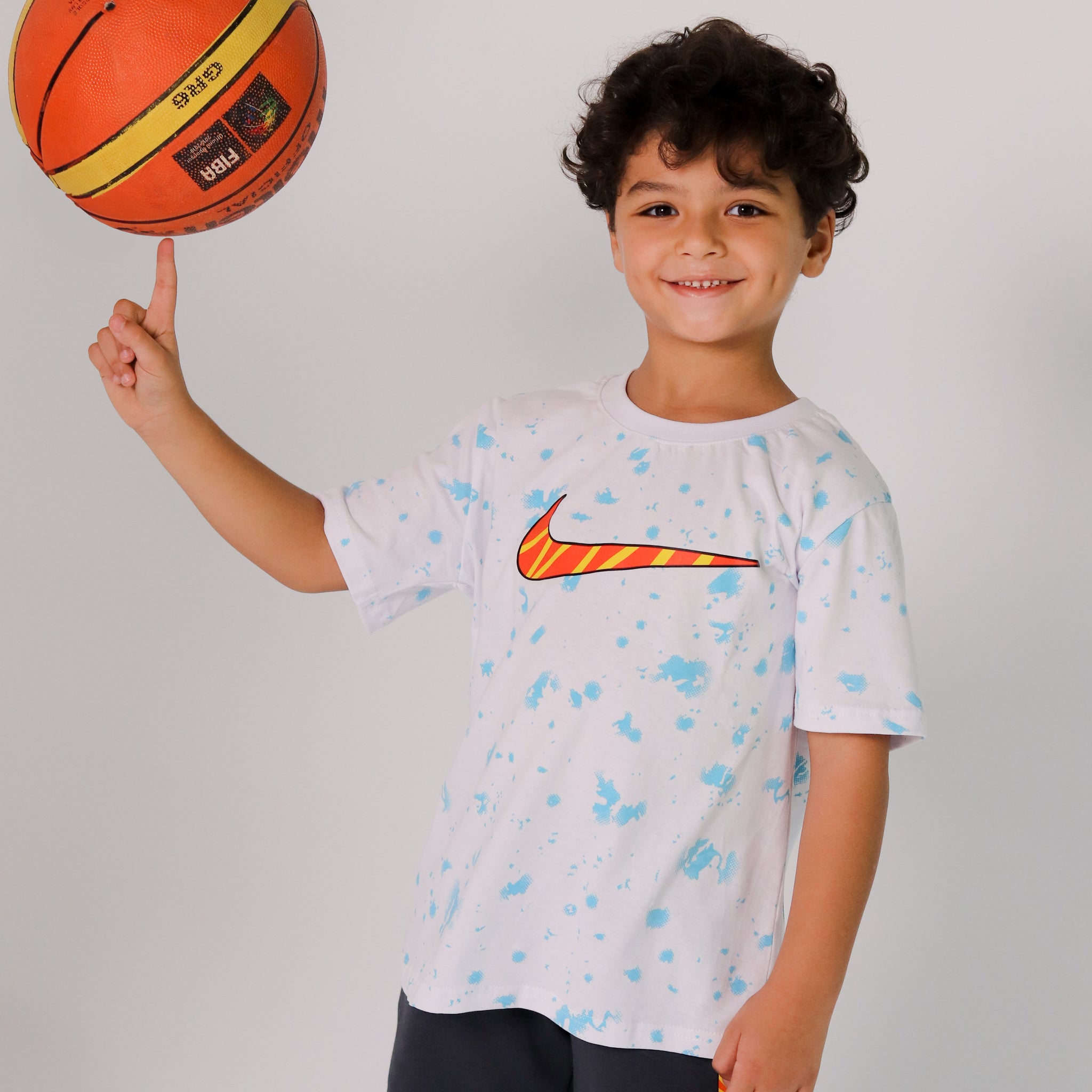 Boys' Nike Skate Set – White Splash Tee with Orange Swoosh & Dark Shorts