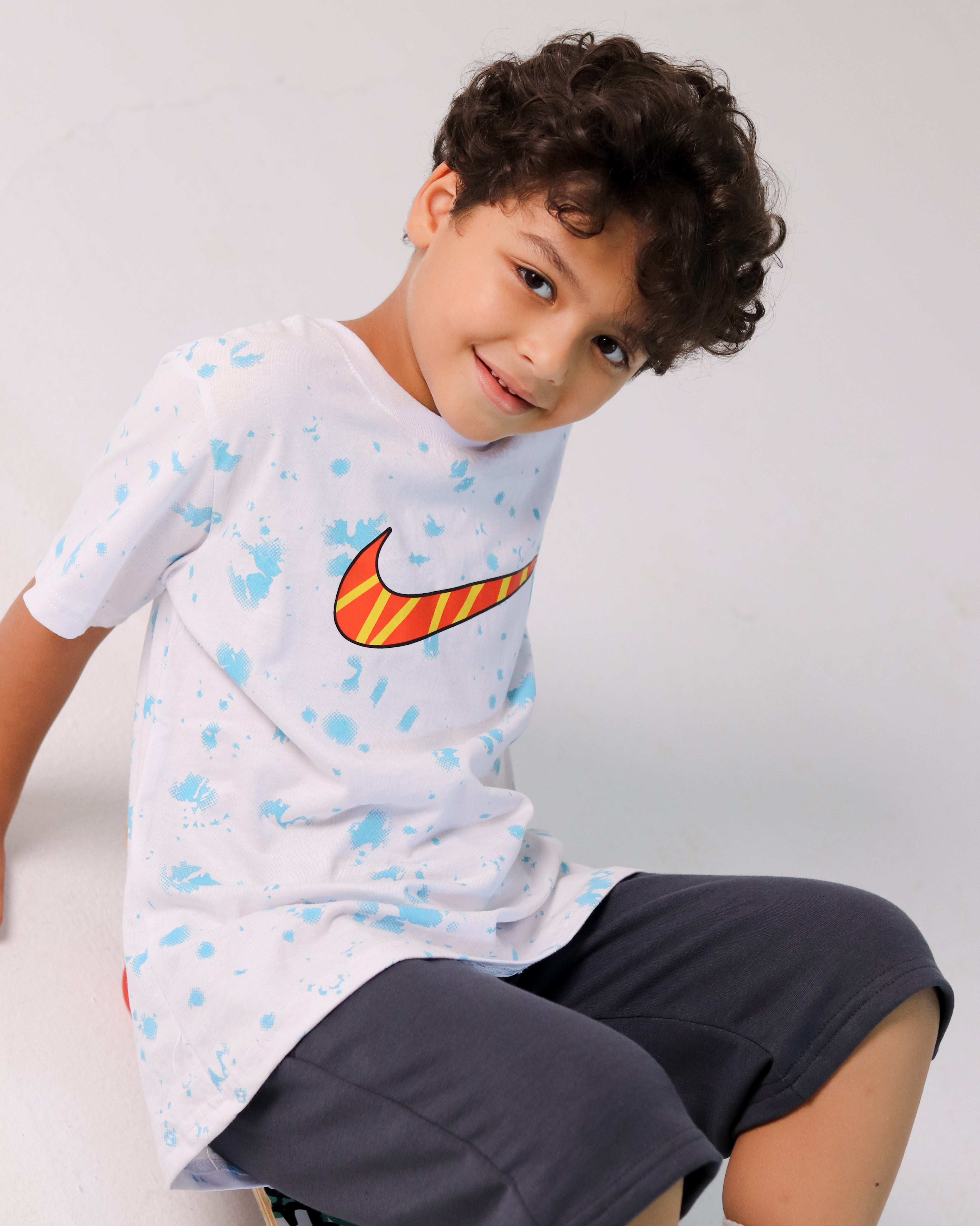 Boys' Nike Skate Set – White Splash Tee with Orange Swoosh & Dark Shorts